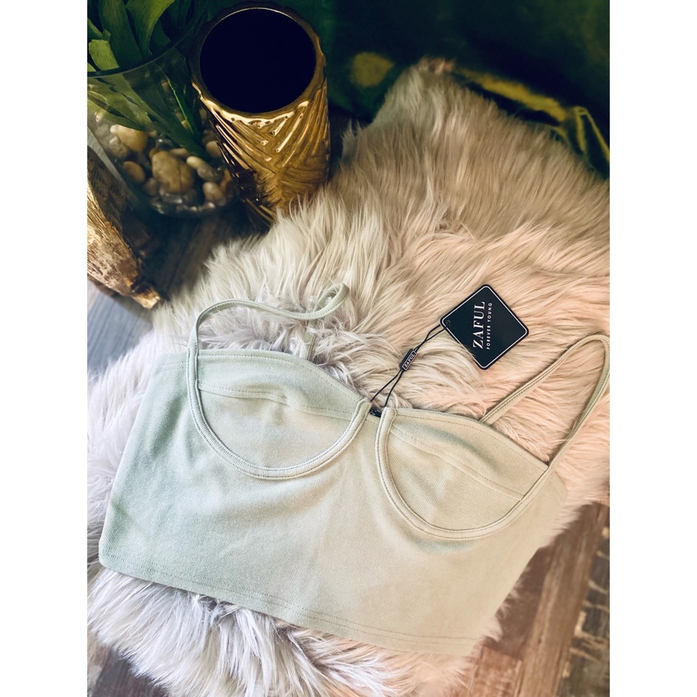 Stylist, mint green crop top. Tight fit